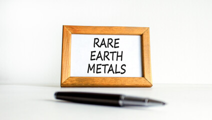 Rare earth metals symbol. Concept words Rare earth metals on beautiful wooden picture frame. Black...