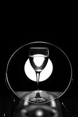 Glass with a water reflected in mirror