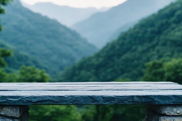 Fototapeta premium Empty stone table showcasing misty mountain landscape for natural products