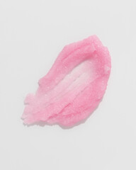 Pink sugar scrub smear smudge swatch. Natural cosmetic skin exfoliation product sample