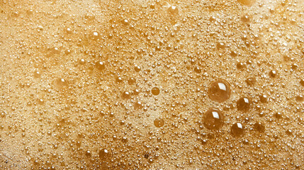 Close Up View Of Golden Brown Foam Texture