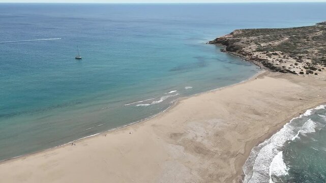Prasonisi, where Aegean Sea meets the Mediterranean Sea. Incredible sandy beach of Prasonisi, in Rhodes Island of Greece. Prasonisi is a natural wavebreaker.