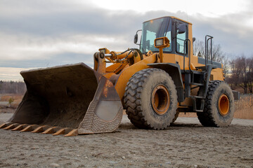 Yellow Loader With Wide Shovel At Construction Site