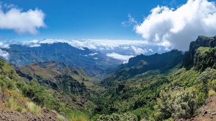 Fototapeta premium Dramatic panoramic view of a vast mountainous landscape with clouds