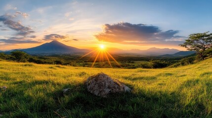 This picturesque image captures the enchanting sunset light illuminating the mountain view, creating a captivating scene that radiates peace and natural beauty.