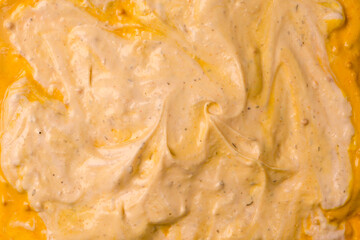 Yellow sauce splashes as a background.