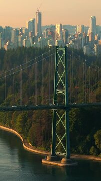 Aerial view of Lions Gate Bridge and Stanley Park at dawn. Canada