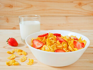 Golden cornflakes cereal with strawberries