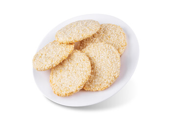 Sesame seeds cookies in a plate on a white isolated background