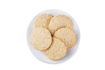 Sesame seeds cookies in a plate on a white isolated background