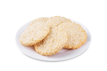 Sesame seeds cookies in a plate on a white isolated background