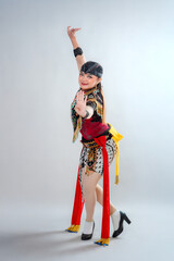 A female dancer gracefully poses in traditional Javanese attire, performing the Jathilan dance, a vibrant cultural expression from Indonesia showcasing strength, elegance, and heritage.