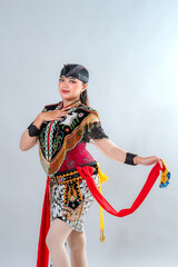 Javanese Jathilan dancer in vibrant traditional attire performs a graceful pose, showcasing Indonesia’s rich cultural heritage through detailed costume, colors, and expressive elegance.