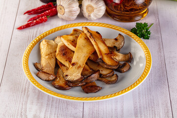 Roasted eringi mushrooms in the plate