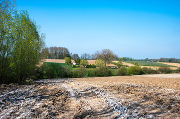 Fertilized and ploughed agriculture fields at the Flemish countryside in Herzele, East Flanders,...