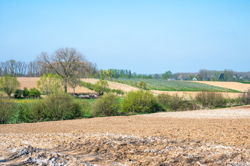 Fertilized and ploughed agriculture fields at the Flemish countryside in Herzele, East Flanders,...