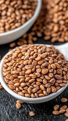 A refined display of wheat ears and a white spoon overflowing with grain on a dark background, perfect for bakery and kitchen themes.