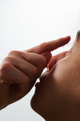 Man is wearing daily contact lenses for eyesight correction. Vision correction with eye contact...
