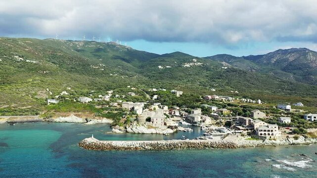 The Village of Centuri flourishes in dry and green reliefs, in Europe, in France, in Corsica, on the edge of the Mediterranean Sea, in summer, on a sunny day.&nbsp;