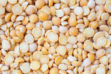 Close-up of dried yellow split peas, filling the frame. Perfect for backgrounds, vegetarian food...