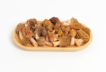 Fresh Morel Mushrooms on Wooden Plate, Morchella esculenta