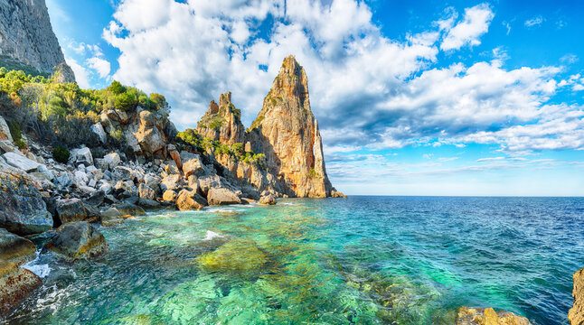Exciting  view of Punta Pedra Longa and azure water in sea.