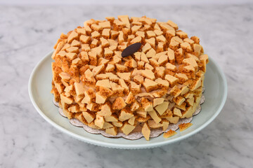 Coffee Crunch Cake Garnished with Toffee Pieces perfect for food photography and culinary dessert sweets side view