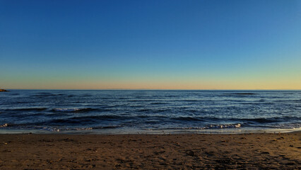 Serene Sunset Over Marbella's Tranquil Coastline