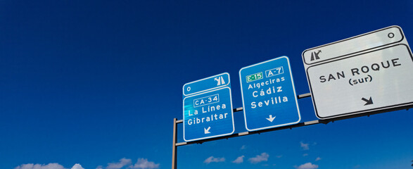 Road signs showing directions to La Linea, Gibraltar, Algeciras, Cadiz, Seville and San Roque in Andalusia, Spain © 4kclips