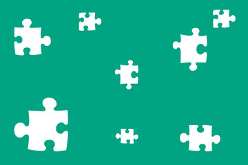 Naklejka premium Colorful jigsaw puzzle pieces scattered on a vibrant teal background creating an abstract design