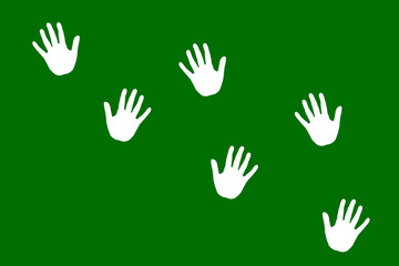 Colorful handprints on green background showcasing creativity and expression with playful design elements