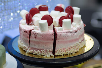 Delicious pink cake on a shop window close-up