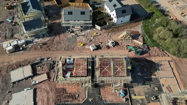 Paignton, South Devon, England: DRONE VIEWS: A new build housing development under construction on green belt land at White Rock. Paignton is a popular UK holiday resort and retirement area (Clip 3).