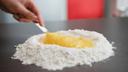Mix Eggs And Flour For The Typical Sweet Food