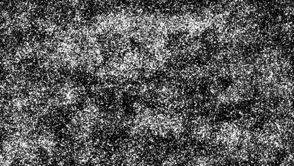 Abstract black and white speckled background with a high-contrast, chaotic pattern. Suitable for use in graphic design, print, and fabric textures.