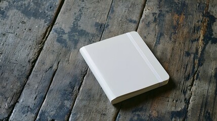 Fototapeta premium Blank White Notebook on Rustic Wooden Table
