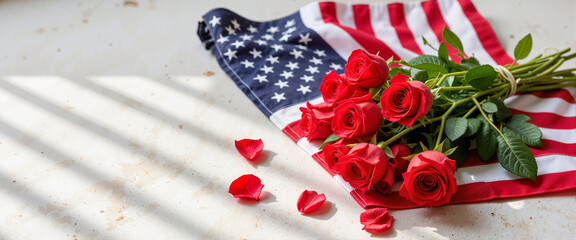 Obraz premium American flag adorned with red roses and petals 