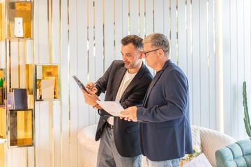 two Business man Executives Analyzing Financial Data Charts  Project in Luxury Interior Setting