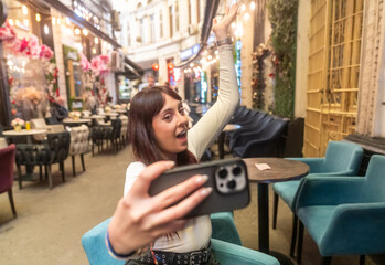 Influencer making content in outdoor cafe