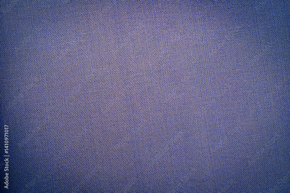 Leinwandbilder Deep blue fabric displays a unique texture, reflecting light and creating a visually engaging surface suitable for various design projects