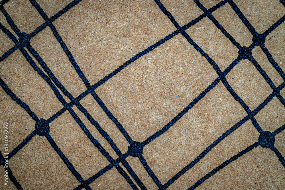 Poster textured carpet showcases a geometric design with a contrasting color scheme, adding depth and chara