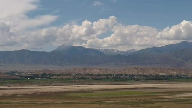 Footage shows a landscape in Central Asia, likely Kyrgyzstan, featuring the Naryn River Valley and the Fergana Mountains, identified as a Key Biodiversity Area (KBA) for conservation.