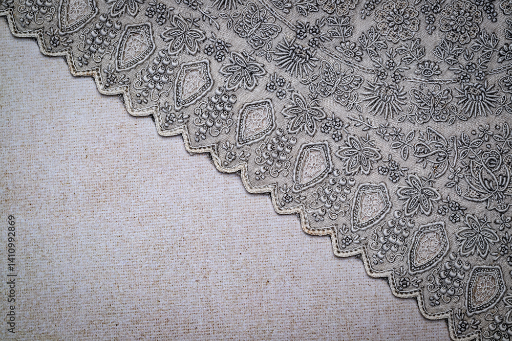 Poster elaborate textile showcases an intricate pattern of flowers and geometric shapes, highlighting fine 