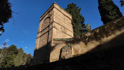 Torre Abd el Aziz dominating Seville cityscape under blue sky