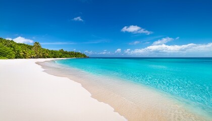 Perfect conditions with bright blue ocean and white sand beach on a sunny day