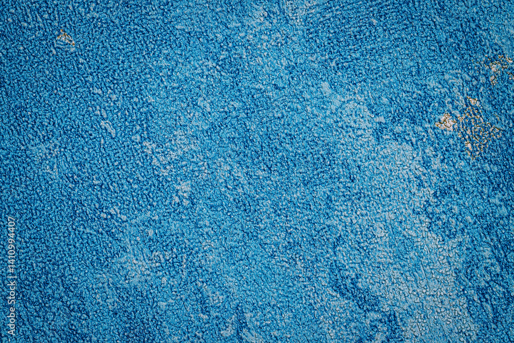 Poster Bright blue surface displays a rich texture with patterns, capturing light and shadows in a captivating way, evoking a sense of warmth