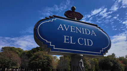 Obraz premium Avenida el cid street sign in Seville, Spain pointing north under blue sky