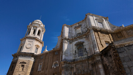 Cadiz Cathedral rising majestically against a vibrant blue sky in Spain
