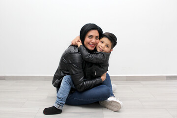 Latina mom and her 6-year-old son show their love and celebrate Mother's Day by spending quality...