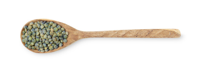 Raw lentils in wooden spoon isolated on white, top view